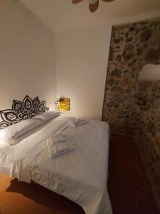 Postel nebo postele na pokoji v ubytování Il Gelsomino - Borgo Lago