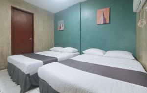 Voodi või voodid majutusasutuse Rcee Place by RedDoorz toas