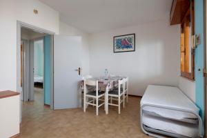 Postel nebo postele na pokoji v ubytování Belvedere Lido Adriano