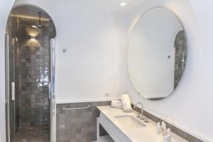 a bathroom with a sink and a mirror at Relais Blu in Massa Lubrense
