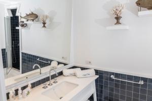 a bathroom with a sink and a mirror at Relais Blu in Massa Lubrense