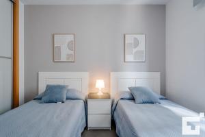 Posteľ alebo postele v izbe v ubytovaní Apartamento Bernia al Mar 9A - Grupo Turis
