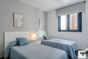 Posteľ alebo postele v izbe v ubytovaní Apartamento Bernia al Mar 9A - Grupo Turis
