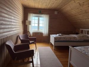 Postel nebo postele na pokoji v ubytování Slettnes Fyr