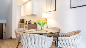 a dining room with a table and chairs at Zen Retreat Studio in Silver Mountain in Poiana Brasov