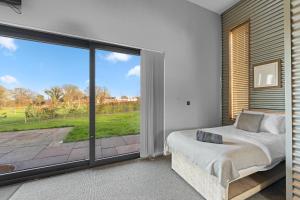 Voodi või voodid majutusasutuse Cosy Cabin Getaway - Ashbourne toas
