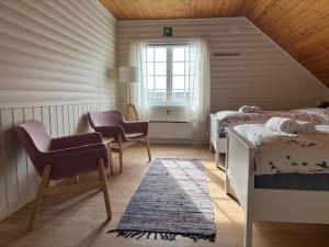 Postel nebo postele na pokoji v ubytování Slettnes Fyr