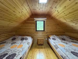 Postel nebo postele na pokoji v ubytování Zlatni pogled