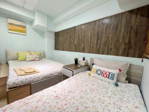 Postel nebo postele na pokoji v ubytování AMU Dreamhouse 阿木旅舍