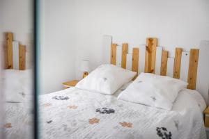 Postel nebo postele na pokoji v ubytování Évasion Océane - Vue mer, Soulac + 7 fotografií