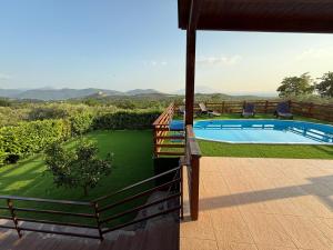 a view of a swimming pool from a house at Villa Aurora&Giulia in Avella +18 photos