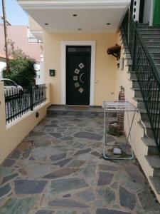 a stairwell with a cart in front of a door at Aellia-Beautiful apartment in Vathi Samos in Vathý