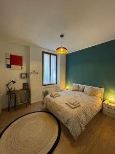 a bedroom with a large bed and a large rug at Casa Gottardo - Tranquillità a due passi dal centro in Monza