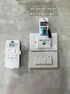 a pay end with a room key on a machine at Samanta By The Hill in Ko Larn