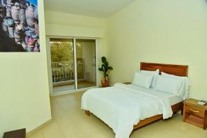 Ένα ή περισσότερα κρεβάτια σε δωμάτιο στο Keur Téranga, Ngor Almadies