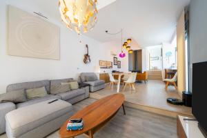 a living room with a couch and a table at Casa Azahar playa Cabo De Gata 2 in Las Hortichuelas Bajas
