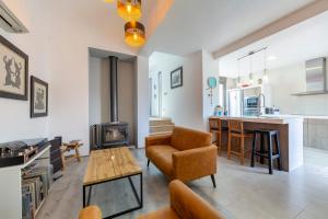 a living room with a couch and a table at Casa Azahar playa Cabo De Gata 2 in Las Hortichuelas Bajas
