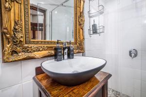 a bathroom with a sink and a mirror at Ataraxia Place in Krugersdorp +18 photos