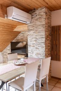 a dining room with a table and chairs at Apartments-Rooms Kocijancic in Bled