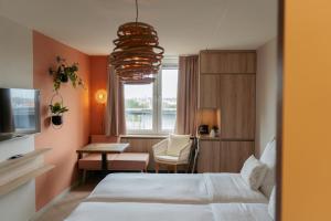 Postel nebo postele na pokoji v ubytování Beachfront Boutiquehotel + 37 fotografií