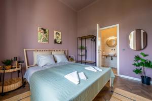 Postel nebo postele na pokoji v ubytování Budapest Central Artpark Suites