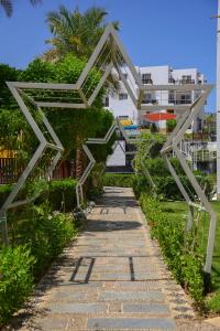 a walkway with a star sculpture in front of a building at Studio102 in Naama bay in Sharm El Sheikh