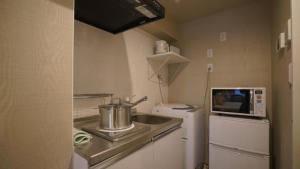 Kuchyň nebo kuchyňský kout v ubytování Le Tour Hotel Akihabara Ekimae 楽途ホテル秋葉原駅前店