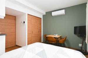 TV a/nebo společenská místnost v ubytování Evergreen hotel ichigaya