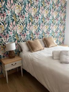 En eller flere senge i et værelse på Ático Arousa Luxe stay