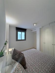 Postel nebo postele na pokoji v ubytování Apartamento en primera línea de playa, con piscina y garaje en Torrox Costa