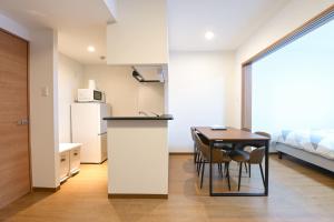 Kuchyň nebo kuchyňský kout v ubytování Evergreen hotel ichigaya
