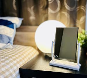 Giường trong phòng chung tại JOJO KK house