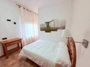 Postel nebo postele na pokoji v ubytování Hostal Castilla
