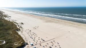 an overhead view of a beach with a group of people at Hotel Atlantic Juist in Juist