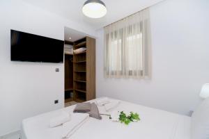 Кровать или кровати в номере Glaroi 3