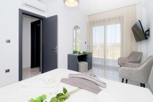 Кровать или кровати в номере Glaroi 3