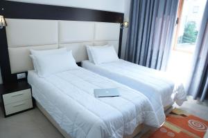 Postel nebo postele na pokoji v ubytování Hotel Vila e Arte City Center