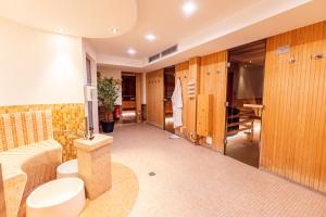 a bathroom with a toilet and a sink at Hotel Atlantic Juist in Juist
