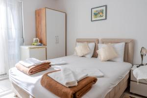 Postel nebo postele na pokoji v ubytování Guest House Vucicevic