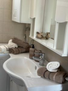 a bathroom with a sink and a mirror at Areti in Fanari +45 photos