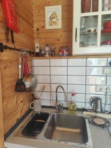 a kitchen with a sink and a counter top at O Gato do Mar in Viana do Castelo +15 photos