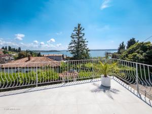 a balcony with a fence and a view of the water at Elegant Apartments BOP in Portorož