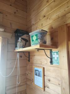 a wooden wall with a shelf in a room at O Gato do Mar in Viana do Castelo