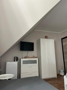 Telewizja i/lub zestaw kina domowego w obiekcie Zatoka Stegna