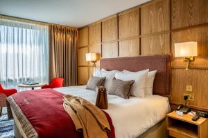 Voodi või voodid majutusasutuse Dublin Skylon Hotel toas