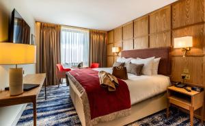 Voodi või voodid majutusasutuse Dublin Skylon Hotel toas