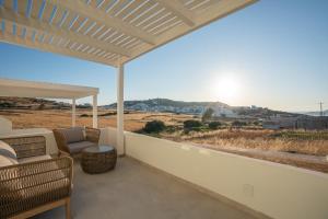 a balcony with a view of the desert at Kimolos Vibes Suites in Kimolos