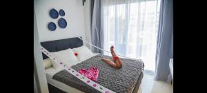 a bedroom with a bed with a toy snake on it at Studio102 in Naama bay in Sharm El Sheikh +6 photos