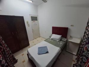 Un pat sau paturi într-o cameră la david hostel