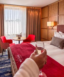 Voodi või voodid majutusasutuse Dublin Skylon Hotel toas